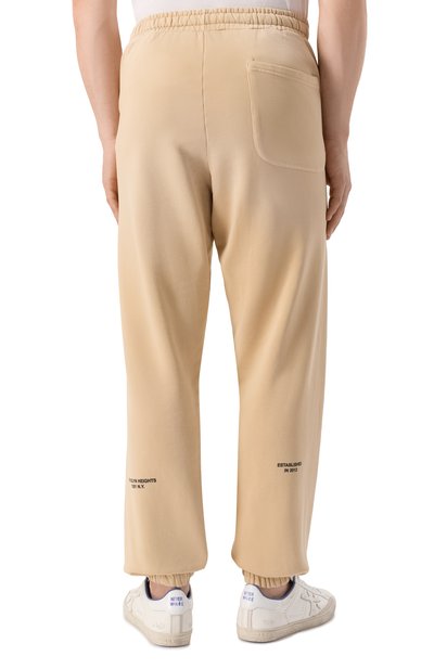 Хлопковые джоггеры COMME DES FUCKDOWN бежевого цвета по цене 14150 руб., арт. CFABM01743, фото 4 Хлопковые джоггеры COMME DES FUCKDOWN, арт. CFABM01743, фото 4