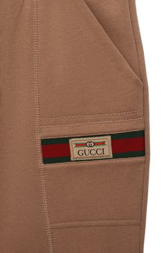 Мужского хлопковые джоггеры GUCCI бежевого цвета, арт. 653667/XJDKA | Фото 3 (Региональные ограничения белый список (Axapta Mercury): Не проставлено; Unisex kids: Брюки; Материал сплава: Проставлено; Нос: Не проставлено; Мальчики Кросс-КТ: Джоггеры-одежда; Ростовка одежда: 10 - 11 лет | 140 - 146см, 12 лет | 152 см, 4 года | 104 см, 5 лет | 110 см, 6 лет | 116 см, 8 лет | 128 см)