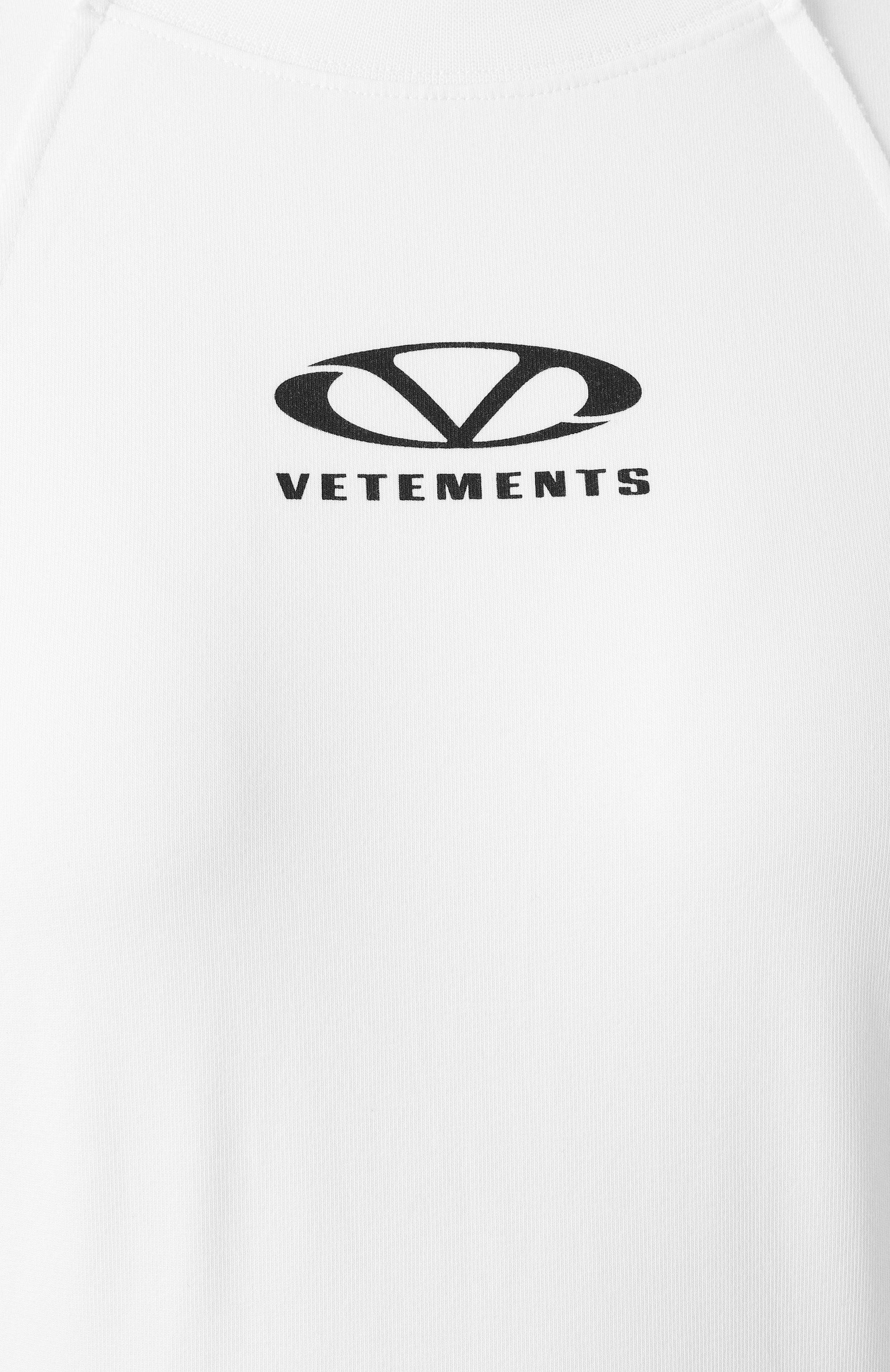 Хлопковый топ VETEMENTS белого цвета по цене 79950 руб., арт. UA66LS600W, фото 6 Хлопковый топ VETEMENTS, арт. UA66LS600W, фото 6