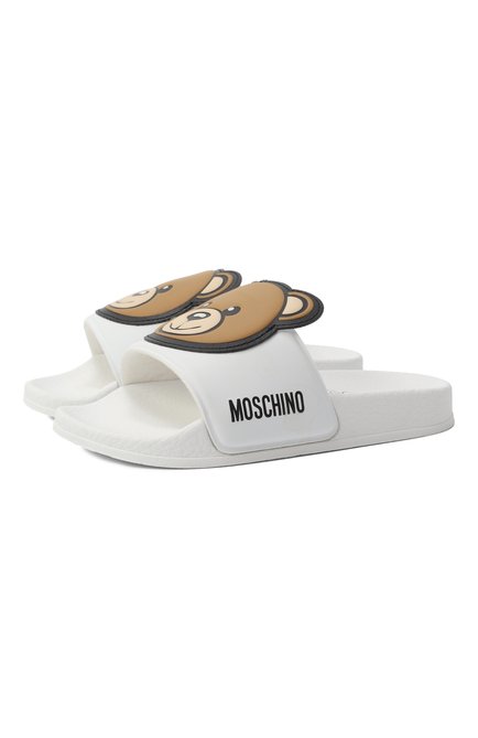 Детский шлепанцы MOSCHINO белого цвета, арт. 80632/VAR2/24-27 | Фото 1 (Материал сплава: Про�ставлено; Материал внешний: Резина, Пластик; Материал внутренний: Текстиль, Резина; Нос: Не проставлено)