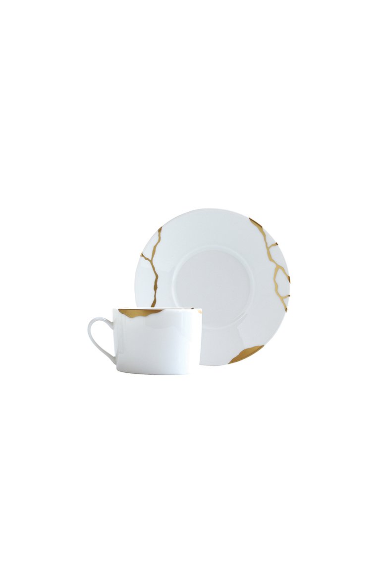 Чайная чашка с блюдцем kintsugi BERNARDAUD золотого цвета, арт. 1095/91 | Фото 1 (Региональные ограничения белый список (Axapta Mercury): Не проставлено; Нос: Не проставлено; Коллекция: Kintsugi; Ограничения доставки: fragile-2)