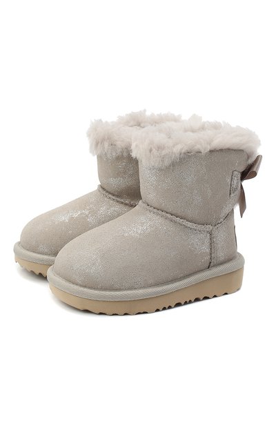 Угги mini bailey bow ii shimmer UGG серебряного цвета по цене 10600 руб., арт. 1116173T_GOA, фото 1 Угги mini bailey bow ii shimmer UGG, арт. 1116173T_GOA, фото 1