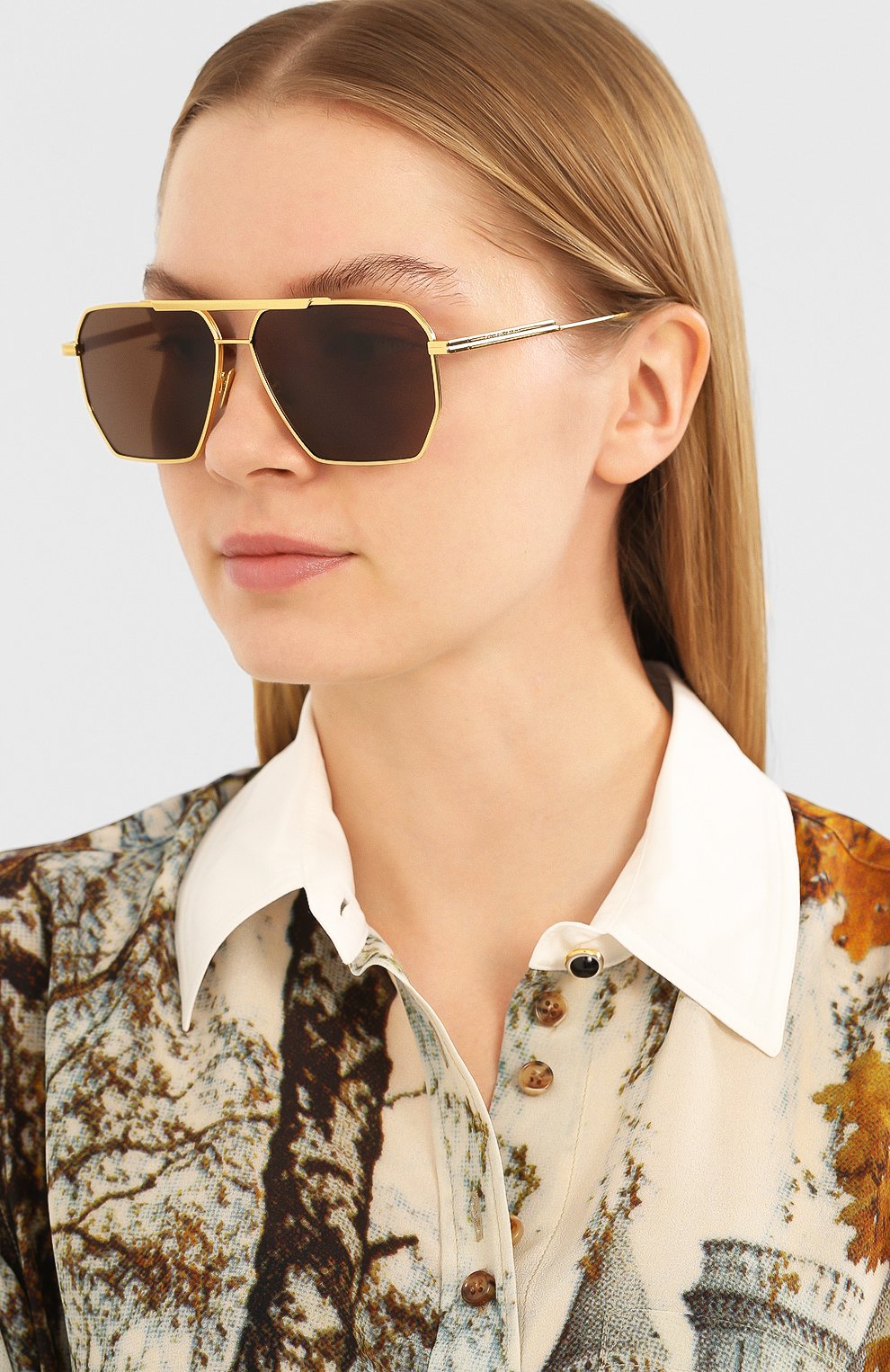 Солнцезащитные очки BOTTEGA VENETA золотого цвета по цене 45400 руб., арт. BV1012 003, фото 2 Солнцезащитные очки BOTTEGA VENETA, арт. BV1012 003, фото 2