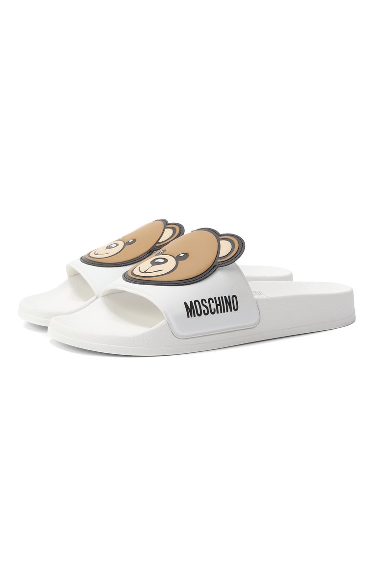 Детский шлепанцы MOSCHINO белого цвета, арт. 80632/VAR2/36-40 | Фото 1 (Материал внутренний: Резина, Текстиль; Материал внешний: Резина, Пластик; Нос: Не проставлено; Автоматизация состава: Проставлено)