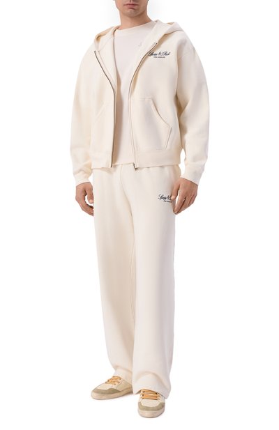Хлопковые брюки SPORTY AND RICH кремового цвета по цене 32200 руб., арт. PA07176269WH37, фото 2 Хлопковые брюки SPORTY AND RICH, арт. PA07176269WH37, фото 2