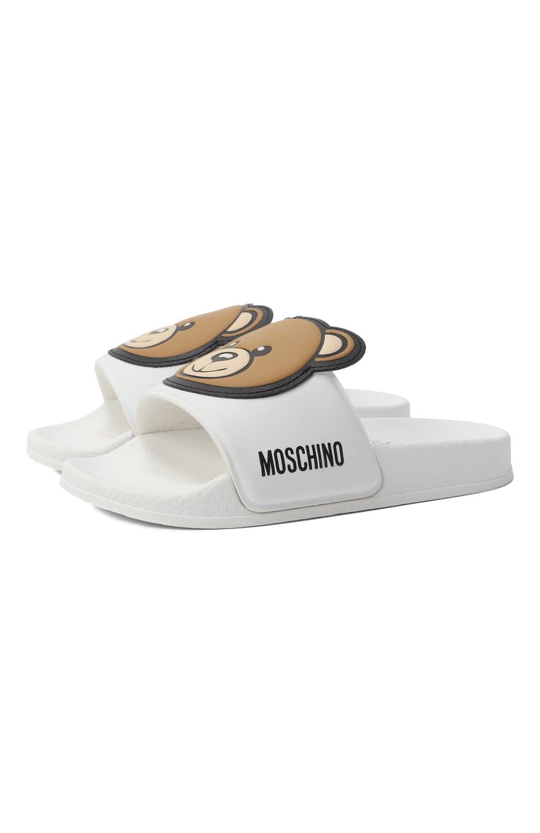 Детский шлепанцы MOSCHINO белого цвета, арт. 80632/VAR2/24-27 | Фото 1 (Материал внешний: Резина, Пластик; Материал внутренний: Текстиль, Резина; Нос: Не проставлено)